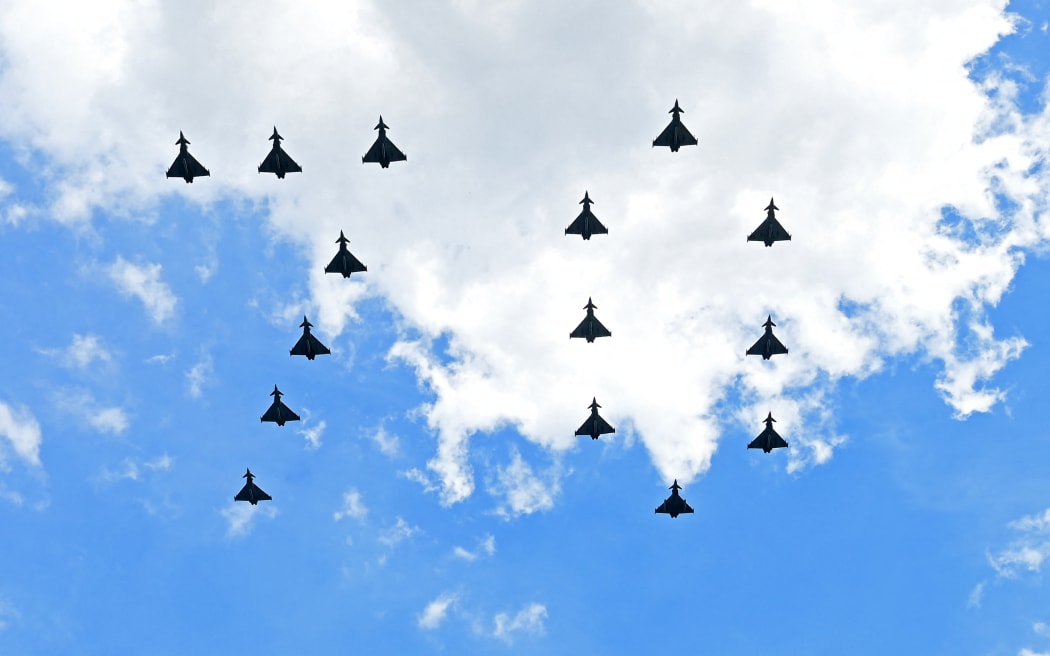 Royal Air Force fighter jets fly in formation to form the number '70' for the Queen's Platinum Jubilee celebrations, in London on June 2, 2022.