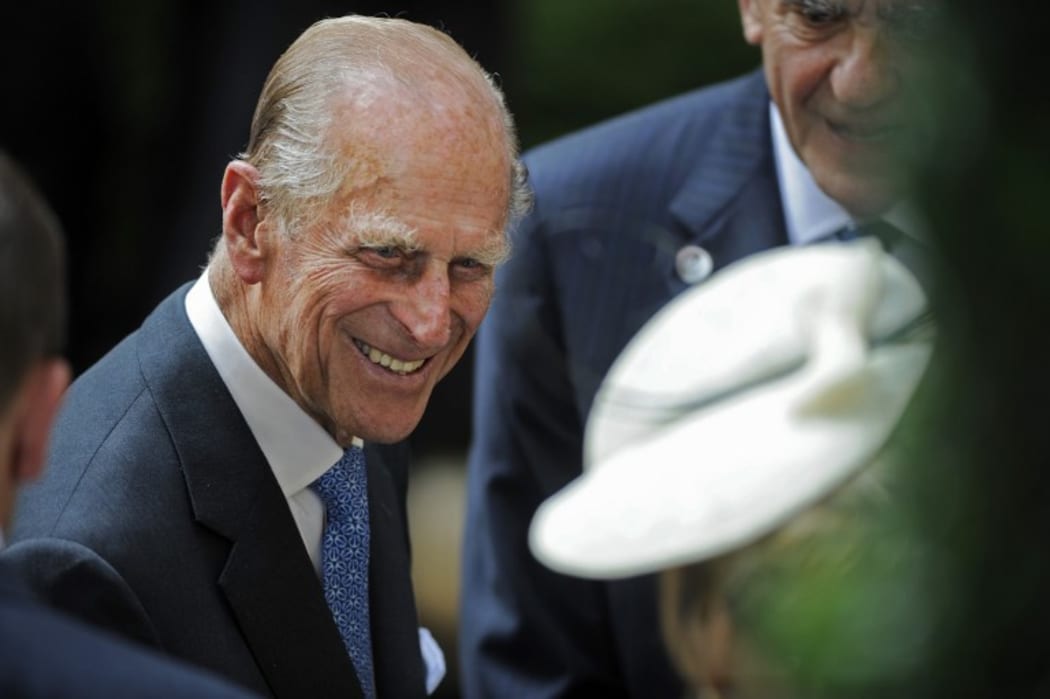 Prince Phillip, the Duke of Edinburgh, is greeted during his visit to the British Garden at Hanover Square in New York, Tuesday, July 6, 2010