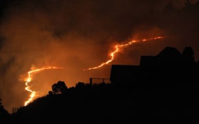 Joseph Johnson: A fire front around behind a Westmorland home stemming from the huge fire on the Port Hills.