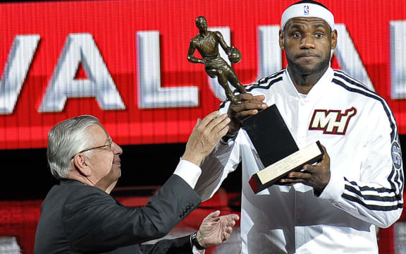 David Stern presents LeBron James with the NBA's MVP award in 2013.