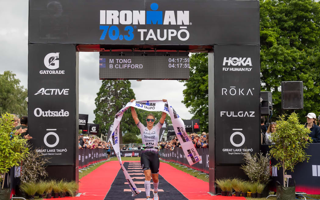 Hannah Berry (nee Wells) of New Zealand wins the Ironman 70.3 Taupo, 2023.