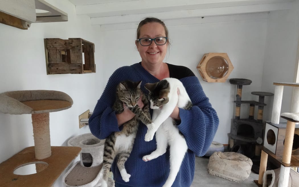 Coast to Coast Cat Rescue founder Sam Stewart with a couple of her feline charges.