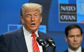 US Secretary of State Marco Rubio (R) listens as US President Donald Trump addresses a press conference during a North Atlantic Treaty Organization (NATO) Heads of State and Government summit in The Hague on June 25, 2025.
