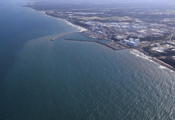 An aerial photo shows the Fukushima No.1 nuclear power plant of Tokyo Electric Power Company Holdings, Incorporated (TEPCO) in Fukushima Prefecture on August 24, 2023. TEPCO announced that Fukushima Daiichi nuclear power plant had started to release treated water stored within the premises of the plant into the ocean on the same day.( The Yomiuri Shimbun ) (Photo by Takuya Matsumoto / Yomiuri / The Yomiuri Shimbun via AFP)