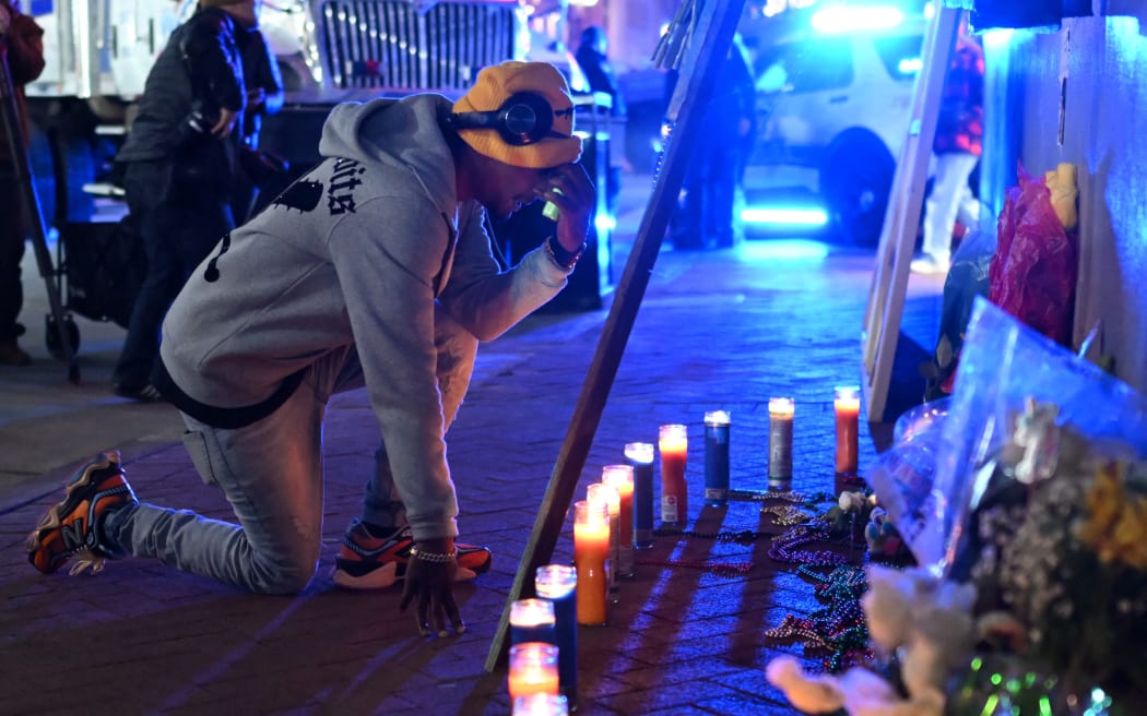A man reacts at a memorial set up on Bourbon Street on January 2, 2025 in New Orleans, Louisiana, the day after an attack by a man driving a truck down Bourbon street in the French Quarter. - A US army veteran loyal to the Islamic State jihadist group likely acted alone when he killed 14 and injured dozens in a truck attack on a crowd of New Year revelers in New Orleans, the FBI said Thursday. Despite initial concerns that Shamsud-Din Jabbar, 42, had accomplices still on the run, preliminary investigations show he likely acted alone, FBI deputy assistant director Christopher Raia said. (Photo by ANDREW CABALLERO-REYNOLDS / AFP)