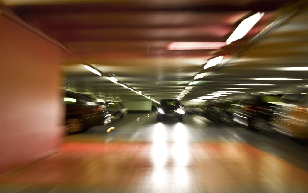 Car driving in parking garage (Photo by James Hardy / AltoPress / PhotoAlto via AFP)