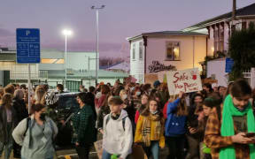 Demonstraters marched to the US embassy in Wellington on Friday night, protesting against the US Supreme Court's ruling on abortion law.