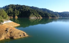 Mangatangi Dam (Watercare’s largest dam), showing low water levels, in the Hunua Ranges.