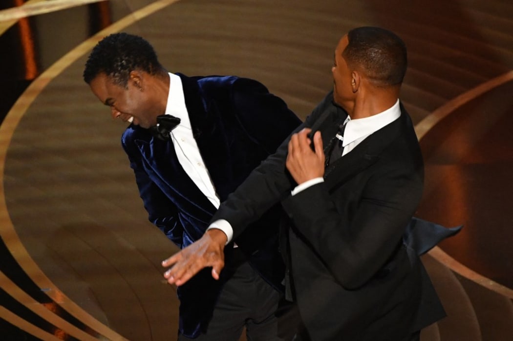 US actor Will Smith slaps US actor Chris Rock onstage during the 94th Oscars at the Dolby Theatre in Hollywood, California on March 27, 2022.