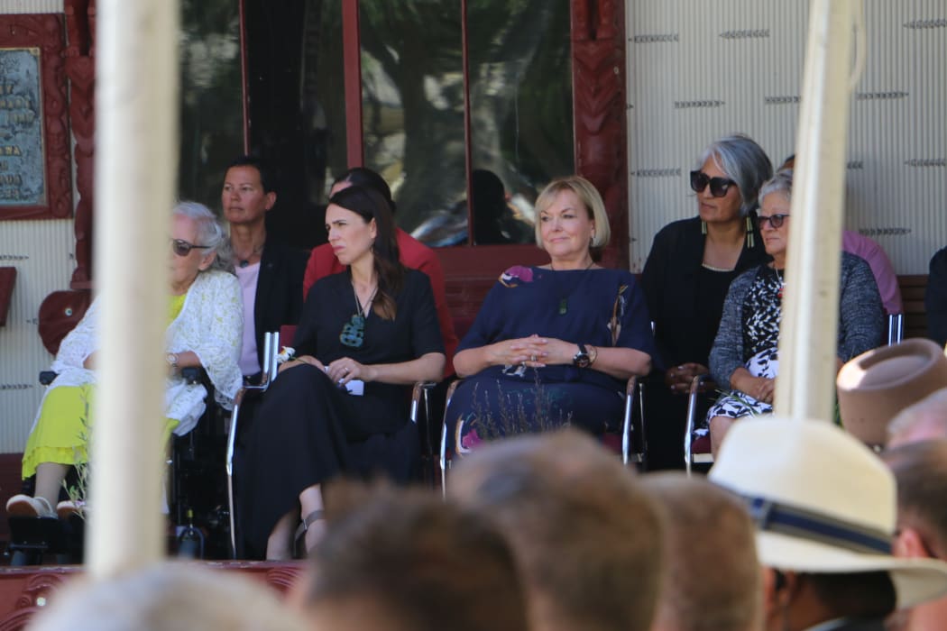 Prime Minister Jacinda Ardern and National Party leader Judith Collins listening to speakers at Te Whare Rūnanga on 4 February, 2021.