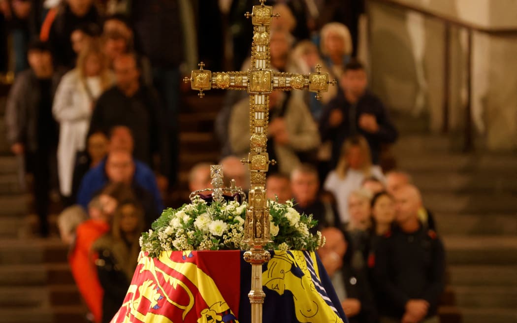 Members of the public pay their respects as they pass the coffin of Queen Elizabeth II as it lies in state inside Westminster Hall, at the Palace of Westminster in London on 15 September, 2022.