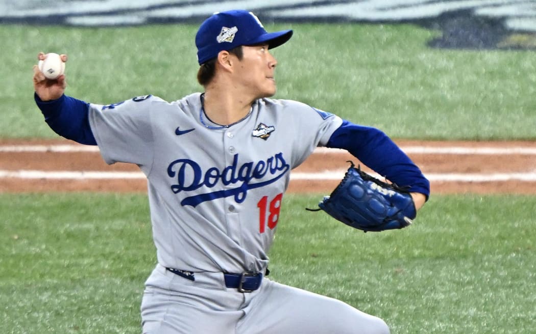Los Angeles Dodgers pitcher Yoshinobu Yamamoto throws a pitch in the tenth inning during Game Seven of the MLB World Series against the Toronto Blue Jays at Rogers Centre in Toronto on  November 2, 2025. ( The Yomiuri Shimbun ) (Photo by Keita Iijima / The Yomiuri Shimbun via AFP)