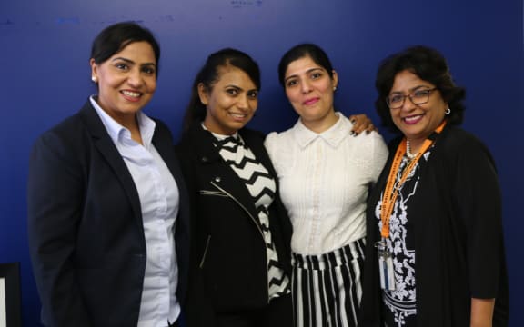 Baljit Dheil, Soni Dheil, Abha Khanna, and Smita Biswas from Auckland Council, work together on Punjabi women's exhibition.