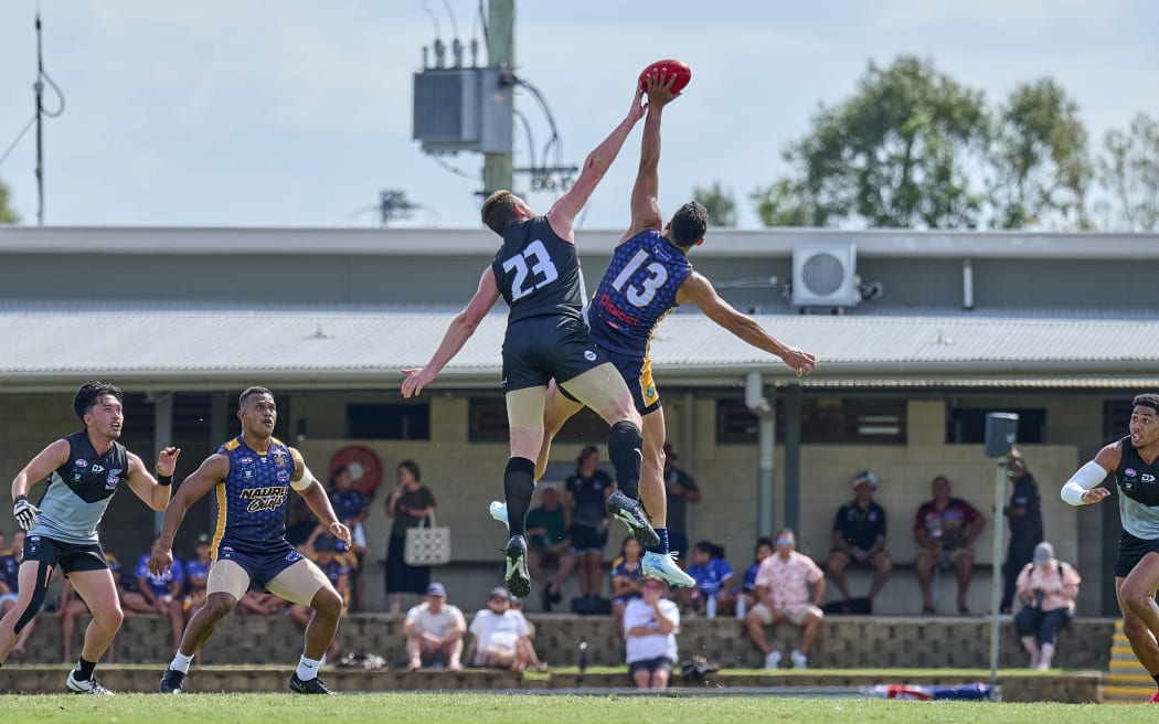 NZ Falcons compete for the ball.