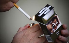 A cigarette pack with plain packaging.