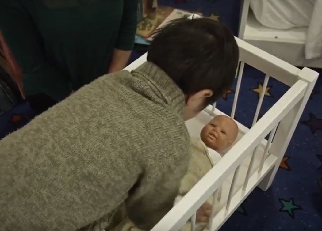 A still from the Safe Sleep Through Doll-Play video.