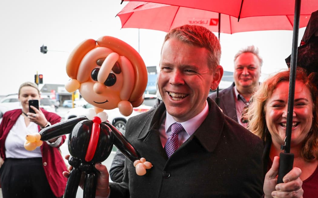 Labour leader Chris Hipkins with his mini-me in balloon form, gifted by Labour supporters outside a store in Nelson, where he was campaigning for the election on 11 September, 2023.