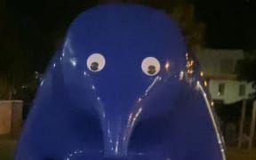 The Cast in Blue sculpture after it had googly eyes put on it.
