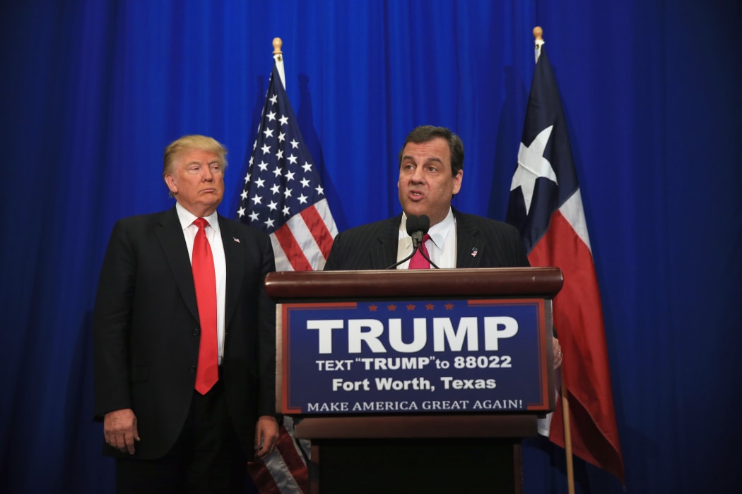 A file photo shows Donald Trump, right, and Chris Christie during a break in the Republican Presidential Candidates' Debate in Manchester, New Hampshire, on 6 February 2016.
