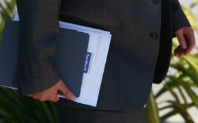 man holding prospectus