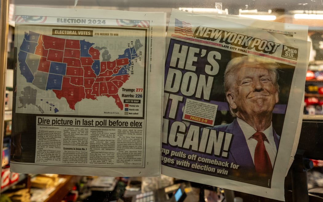 The New York Post is displayed in the window of a newsstand inside of Trump Tower in New York City, November 6, 2024. - Donald Trump won a sweeping victory Wednesday in the US presidential election, defeating Kamala Harris to complete an astonishing political comeback that sent shock waves around the world. (Photo by David Dee Delgado / AFP)