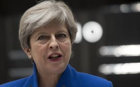 Britain's Prime Minister and leader of the Conservative Party Theresa May, makes a statement outside 10 Downing Street in central London on June 9, 2017