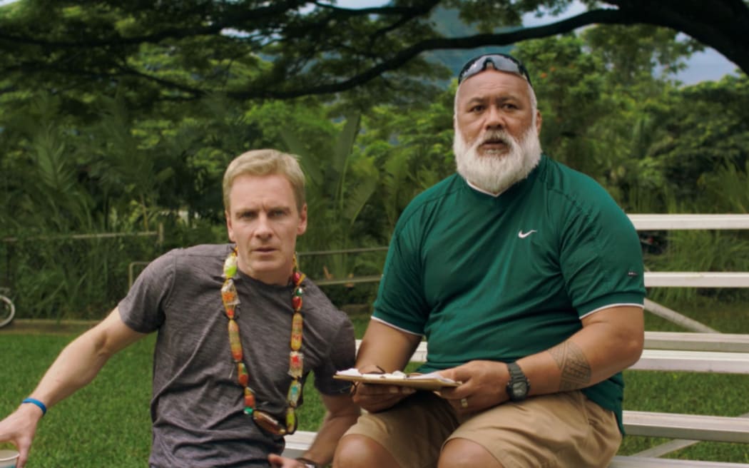 Michael Fassbender as 'Coach Rongen' and David Fane as 'Ace'.