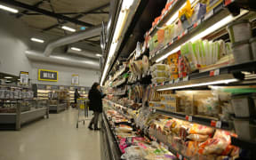 NELSON, NEW ZEALAND, JULY 19, 2018: Unidentified customers examine sale goods in a supermarket.