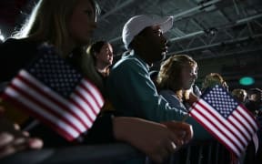 Supporters listen to Democratic presidential candidate Bernie Sanders during a campaign event at Grand View University in Des Moines, Iowa on 31 January 2016.