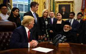 US President Donald Trump meets with survivors of religious persecution (Farid Ahmed, sitting right).