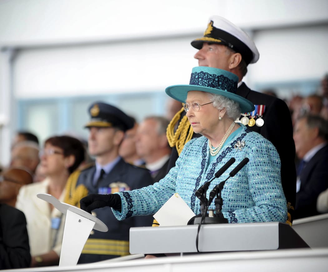 Queen Elizabeth naming the aircraft carrier at Rosyth Dockyard in Scotland.