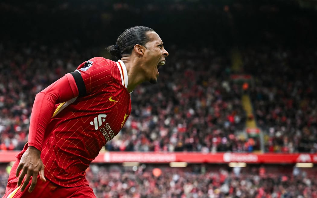 Liverpool defender Virgil van Dijk celebrates after scoring his team's second goal during the English Premier League football match against West Ham at Anfield, 14 April, 2025.