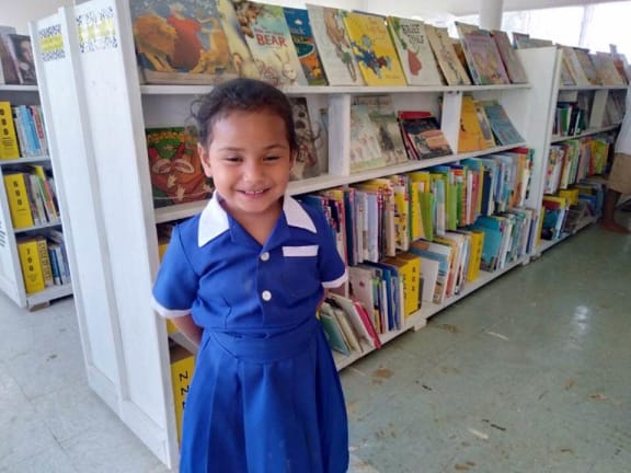 Children with books in Tonga