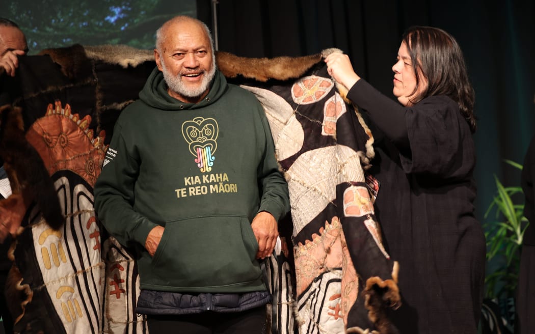 Astronomer and environmentalist Rereata Makiha is wrapped in an Aboriginal possum skin cloak.