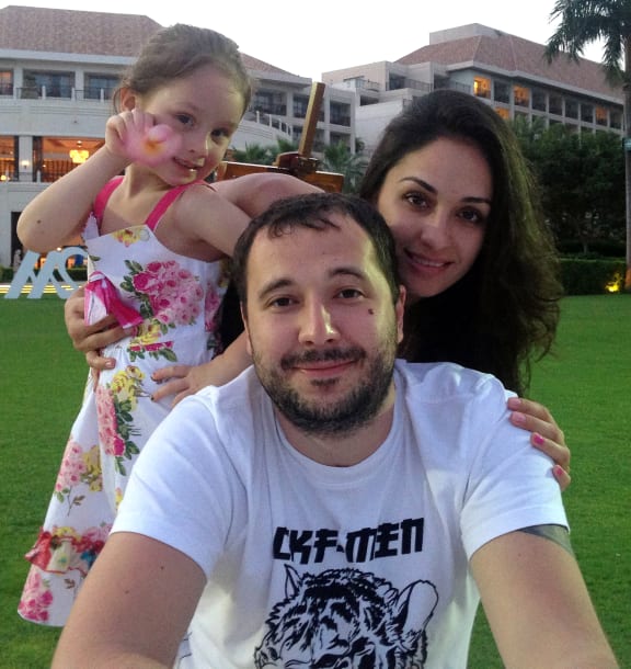 Roman Seleznev, pictured with his family, is currently being held by US authorities on Guam