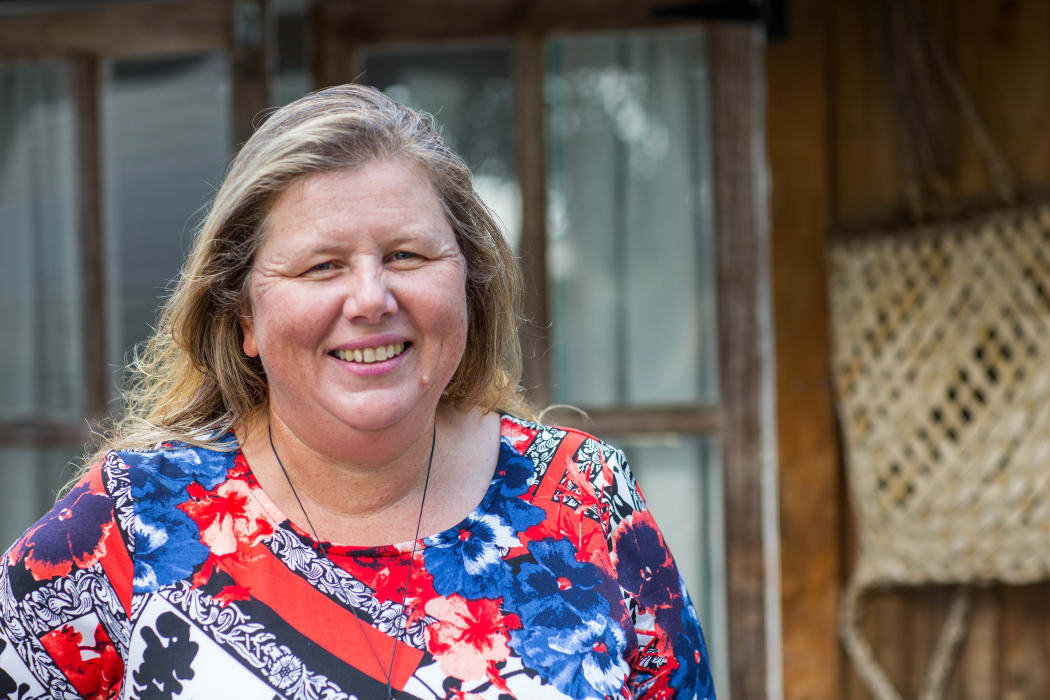 Danielle Bergin outside some of the Island Child Charitable Trust's emergency housing.