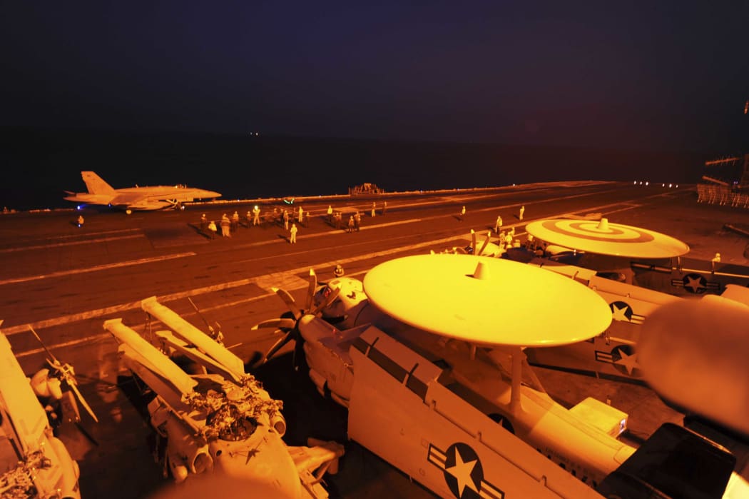 An F/A-18C Hornet prepares to launch from USS George H.W. Bush to conduct strike missions against Islamic State targets in the Arabian Gulf.