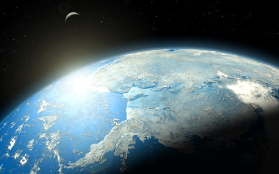Illustration of the Earth from space. This is a view over Antarctica. The Moon is also visible.