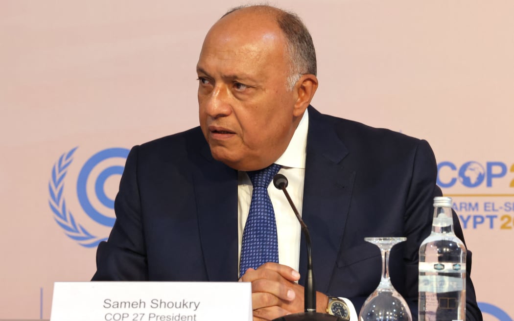 COP27 President Sameh Shoukry speaks during a press conference following the opening ceremony of the 2022 United Nations Climate Change Conference, more commonly known as COP27, at the Sharm El Sheikh International Convention Centre, in Egypt's Red Sea resort of the same name. - The UN's COP27 climate summit kicked off in Egypt with warnings against backsliding on efforts to cut emissions and calls for rich nations to compensate poor countries after a year of extreme weather disasters. (Photo by JOSEPH EID / AFP)