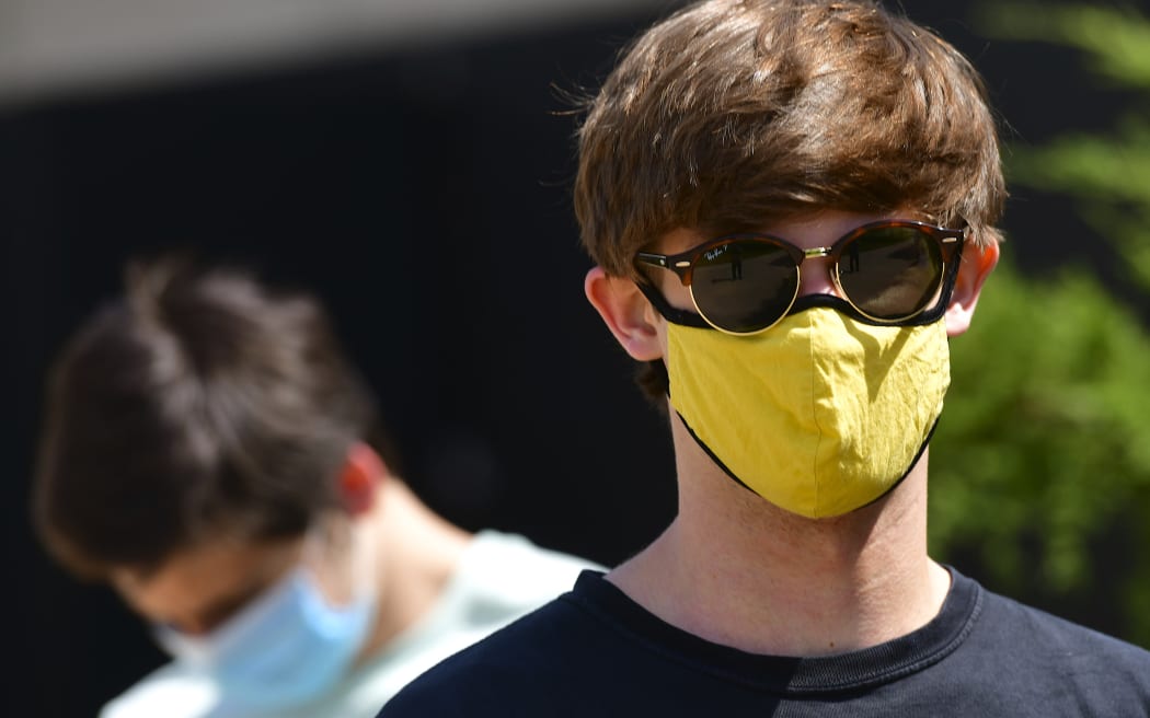 BOULDER, CO - AUGUST 18: Students wear masks while waiting in line for registration and an identifying wristband after receiving a negative test result for coronavirus upon arriving on campus at University of Colorado Boulder on August 18, 2020 in Boulder, Colorado.
