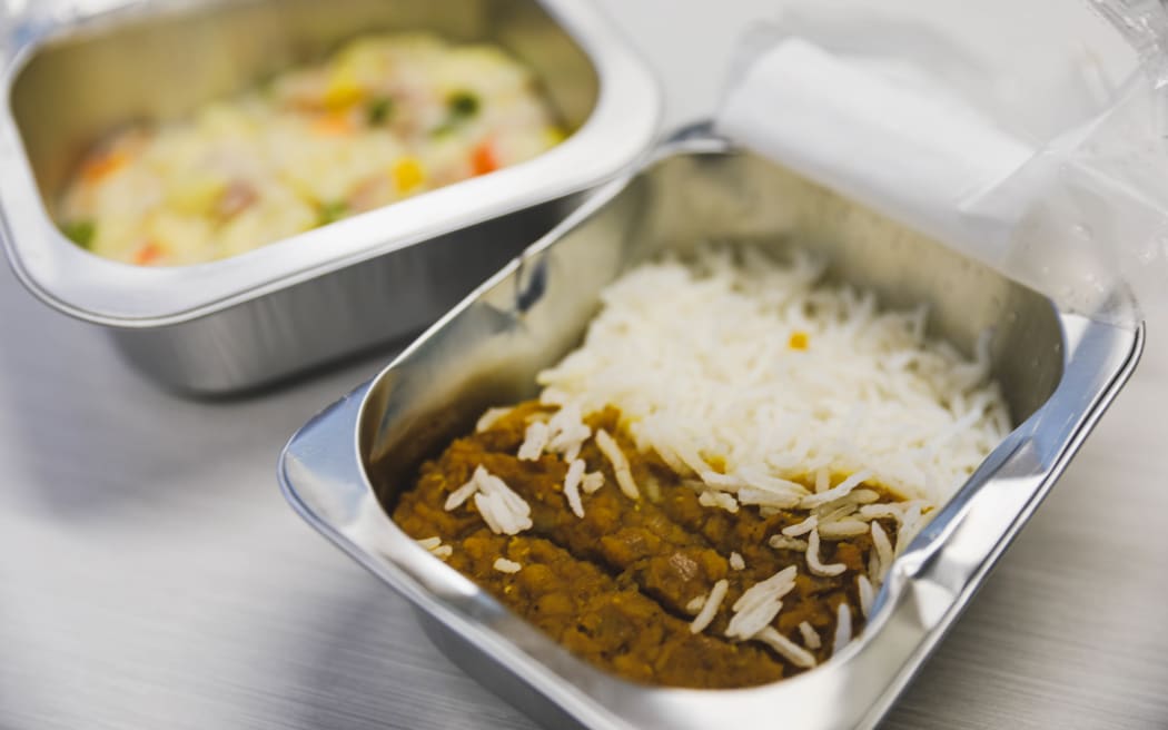 School lunches - Compass example dhal and rice with macaroni in background