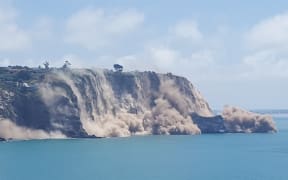 The view from Godley Head Track of a cliff collapsing near Sumner.
