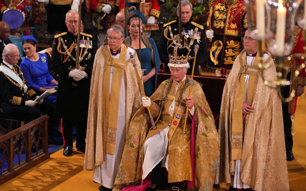 King Charles III with the St Edward's Crown on his head attends the Coronation Ceremony inside Westminster Abbey in central London on 6 May, 2023. - The set-piece coronation is the first in Britain in 70 years, and only the second in history to be televised. Charles will be the 40th reigning monarch to be crowned at the central London church since King William I in 1066. Outside the UK, he is also king of 14 other Commonwealth countries, including Australia, Canada and New Zealand. Camilla, his second wife, will be crowned queen alongside him and be known as Queen Camilla after the ceremony. (Photo by Aaron Chown / POOL / AFP)