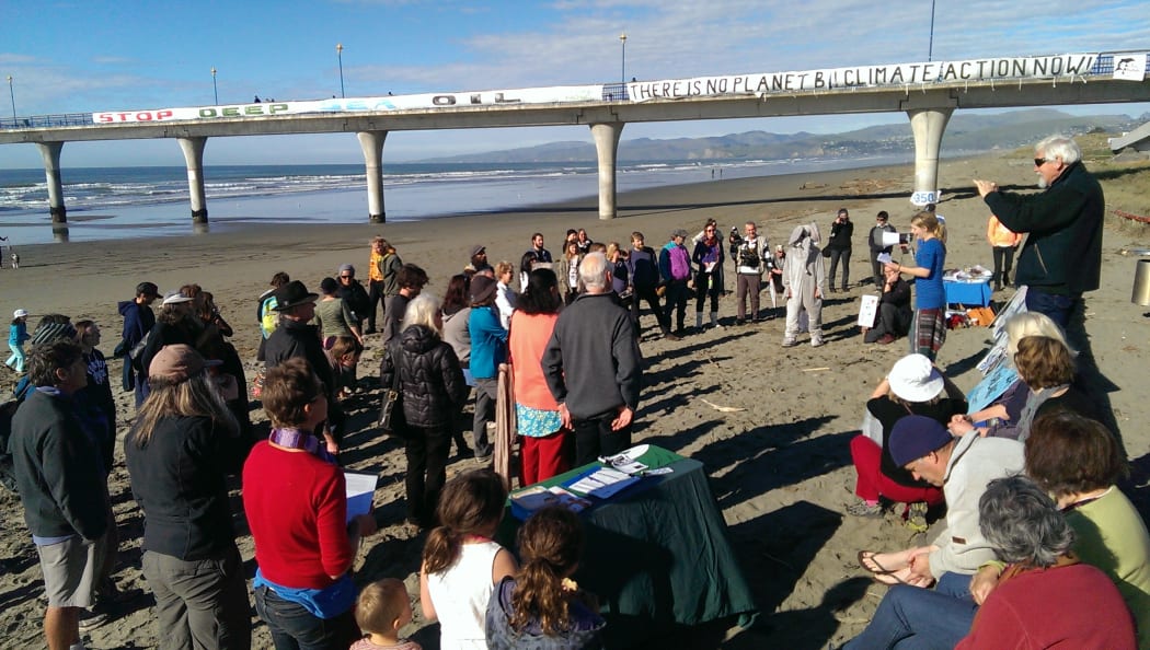 Around 100 gathered at Christchurch's New Brighton beach for Hands Across the Sand event.