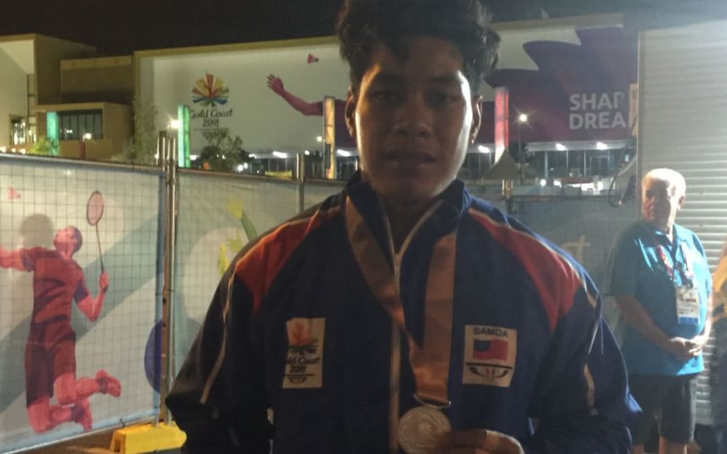 Don Opeloge secures silver in the men's 85kg division.
