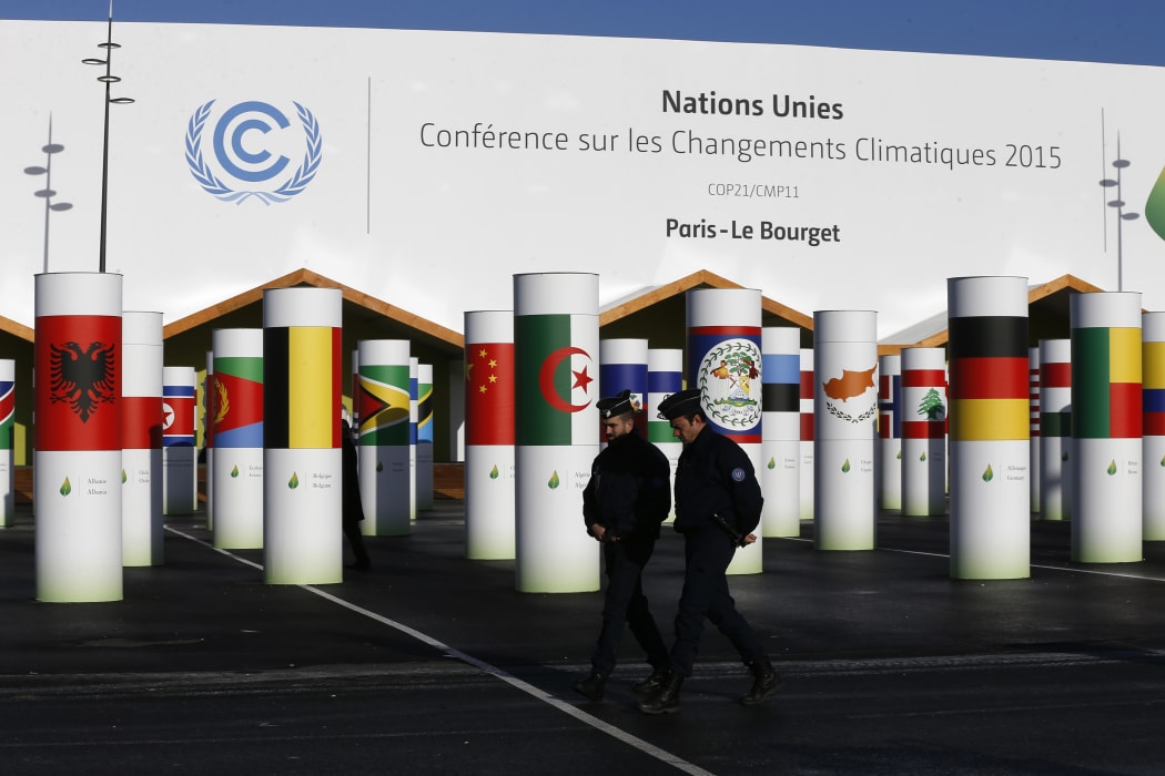 Policemen walk past the conference centre of the United Nations Conference on Climate Change COP21 in Le Bourget, north of Paris.