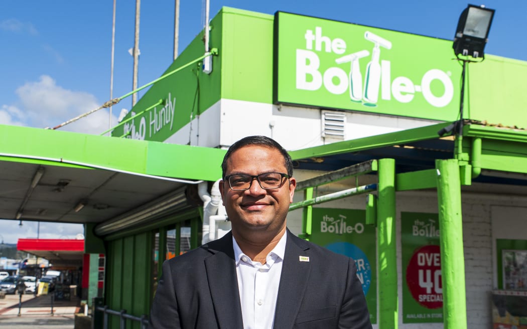 Himanshu Parmar, ACT Party candidate for Hamilton East, standing outside his liquor store.