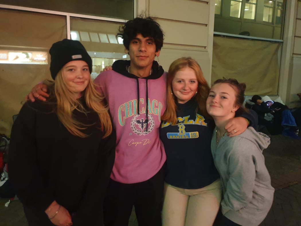 Arian with friends for moral support as he enters his second night in the queue for the latest Nike Air Jordan sneakers.