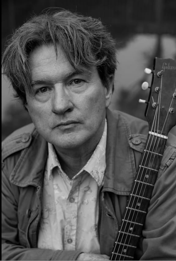 Auckland musician Guy Wishart with guitar