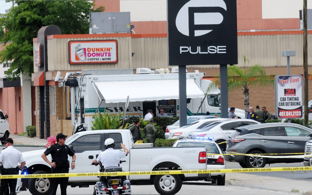 ORLANDO, FLORIDA - JUNE 12: Orlando police officers seen outside of Pulse nightclub after a fatal shooting and hostage situation on June 12, 2016 in Orlando, Florida. The suspected shooter, Omar Mateen, was shot and killed by police.